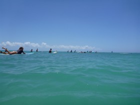 Surfers on the horizon